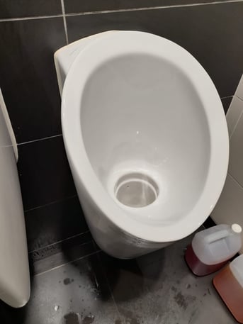 Clean urinal by Initial